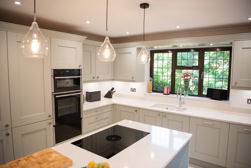 Shaker kitchen in Light Blue by Farrow & Ball with kitchen island with Bora hob and pendant lights